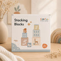 Box of Ego Fun stacking blocks on a wooden surface with decorative elements.