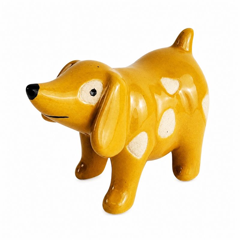 A glossy ceramic dog figurine in mustard yellow with white spots, a black nose, and a black eye, shown on a plain white background.-Dog Pot Hanger