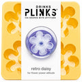 Drinks Plinks - Retro Daisy Yellow Ice Cube Tray in a yellow square tray with a white center label showing a flower-shaped clear ice cube and the text 'retro daisy for flower power attitude'.