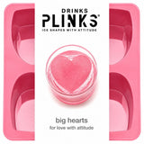Drinks Plinks -Big Heart Pink Ice Cube Tray shown with a white vertical label in the center featuring the brand name 'DRINKS PLINKS' and a heart-shaped pink ice cube in a glass, with the text 'big hearts for love with attitude'.