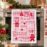 F Word Xmas Red tea towel hanging on an oven handle in a festive kitchen