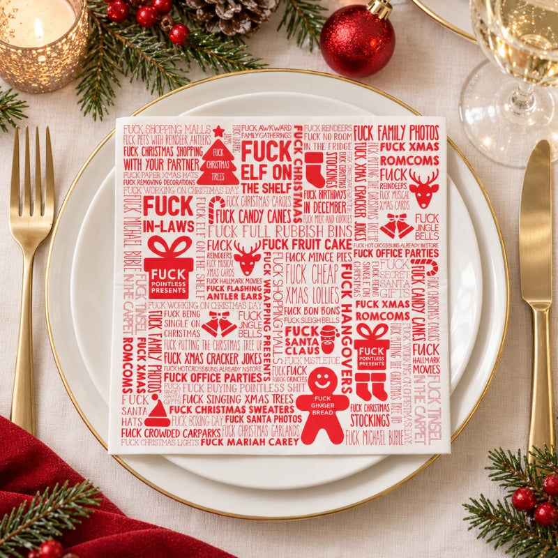 F#ck Christmas paper napkin displayed on a festive dinner plate