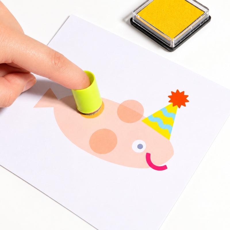 Close-up of child using a finger stamp tool to make fingerprint artwork