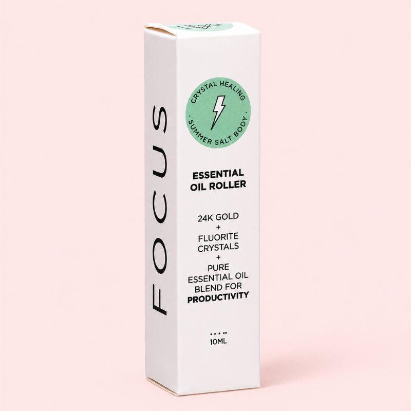 Focus Essential oil roller packaging with branding on a pink background