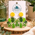 Handmade greenery dangle earrings featuring botanical leaf designs in green polymer clay with yellow stud tops by Love Shack Giftware