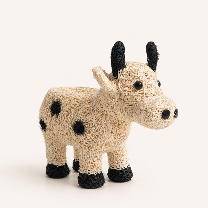 Jersey cow planter in neutral tones on clean beige background