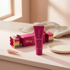 Huxter Pink Pepper and Vanilla Bean Hand Balm Bon Bon styled on a warm neutral vanity