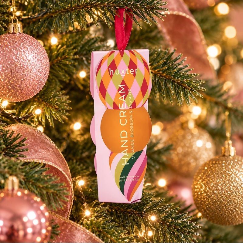 Huxter Orange Blossom and Jasmine hand cream hanging on a Christmas tree