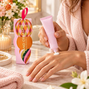 Woman applying Huxter Orange Blossom and Jasmine hand cream