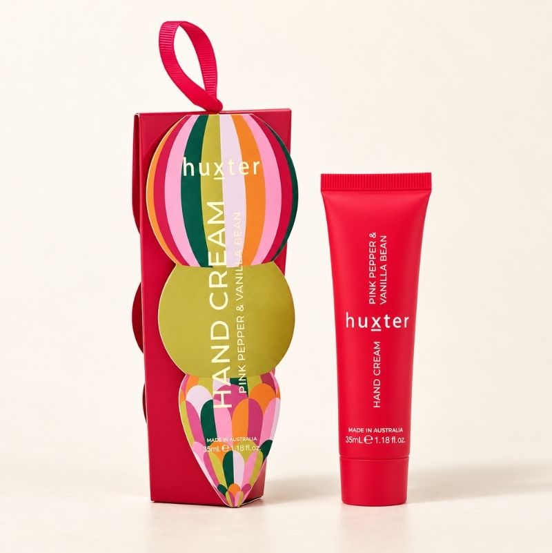 Woman applying Huxter Pink Pepper and Vanilla Bean hand cream
