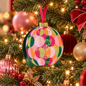 Huxter Vanilla Bean lip balm bauble hanging on a Christmas tree