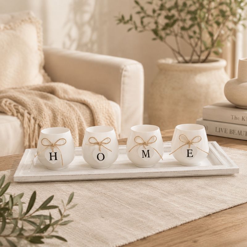 Glowing HOME candle holder tray set displayed on a shelf in a cozy evening setting with warm ambient lighting.