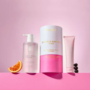Hustle shower pamper duo with body wash, shower gel, and scrub on a pink background