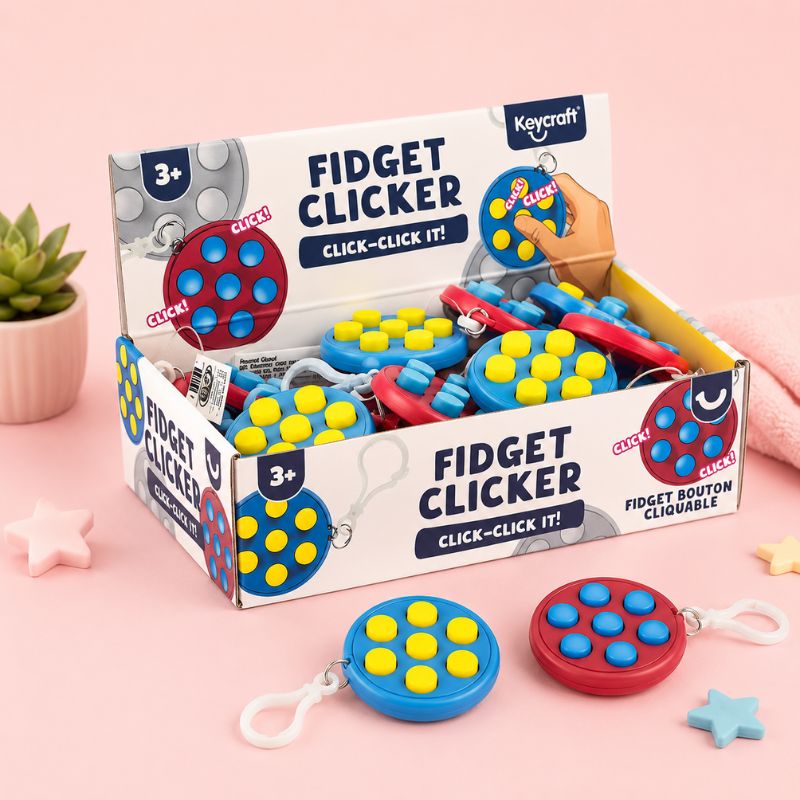 Box of Keycraft fidget clickers on a pink background