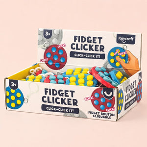 Box of Keycraft fidget clickers on a beige background