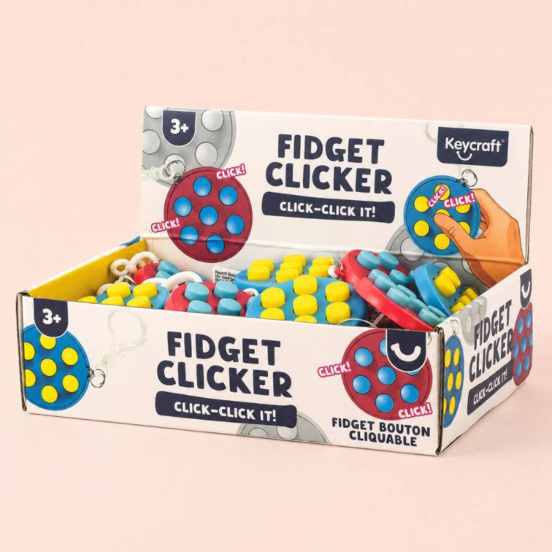 Box of Keycraft fidget clickers on a beige background