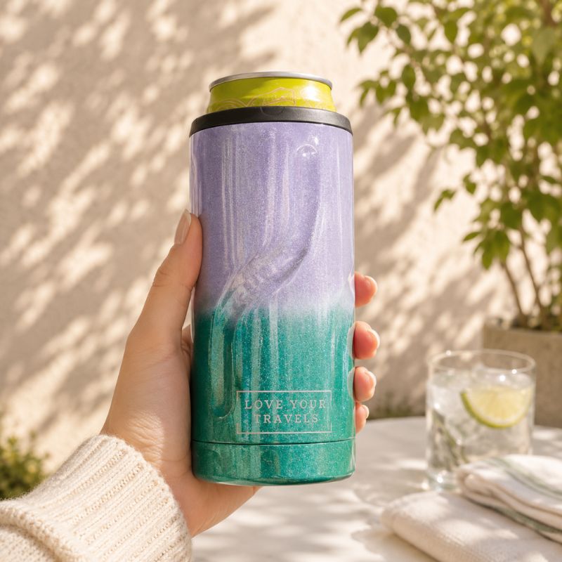 Hand holding a purple to green gradient tumbler with 'Love Your Travels' text, outdoor setting.-Loveshack Giftware