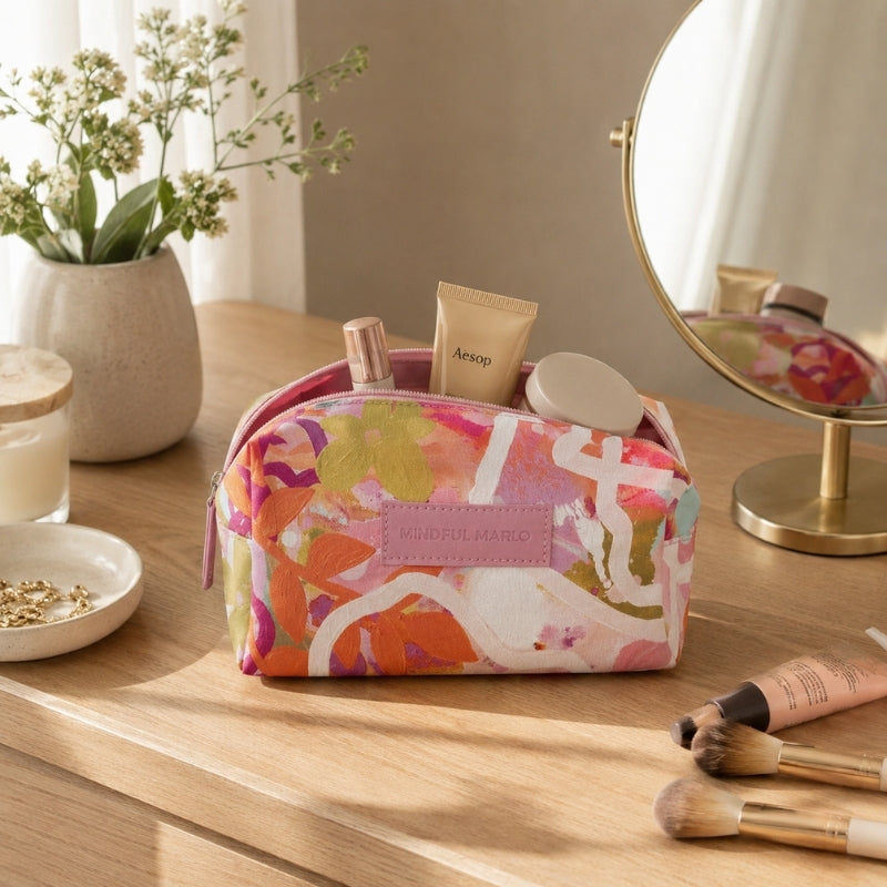 Ivy colorful makeup and cosmetic bag styled with skincare and beauty products