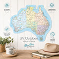 Map of Australia on a wooden surface with a mug, notebook, and hat. - Loveshack Giftware