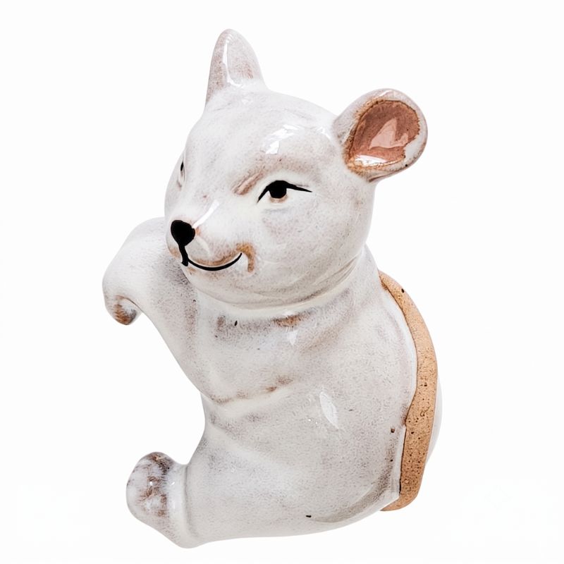 A ceramic wall-mounted animal figurine shaped like a white mouse or rat with a glossy finish, black painted facial features, and a textured tan back, shown against a plain white background.-Mouse Pot Hanger White 9cm