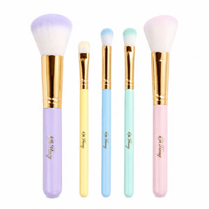 Five Oh Flossy rainbow makeup brushes with soft bristles and pastel handles