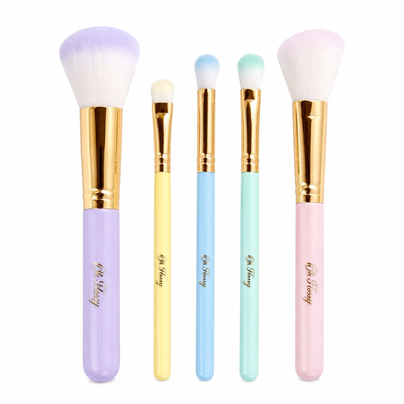 Five Oh Flossy rainbow makeup brushes with soft bristles and pastel handles