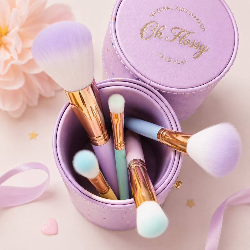 Oh Flossy kids makeup brushes inside a lavender pink storage case