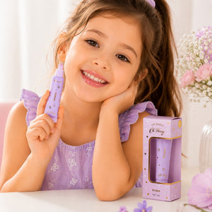 Young girl holding Oh Flossy Grape Natural Lip Gloss for Kids