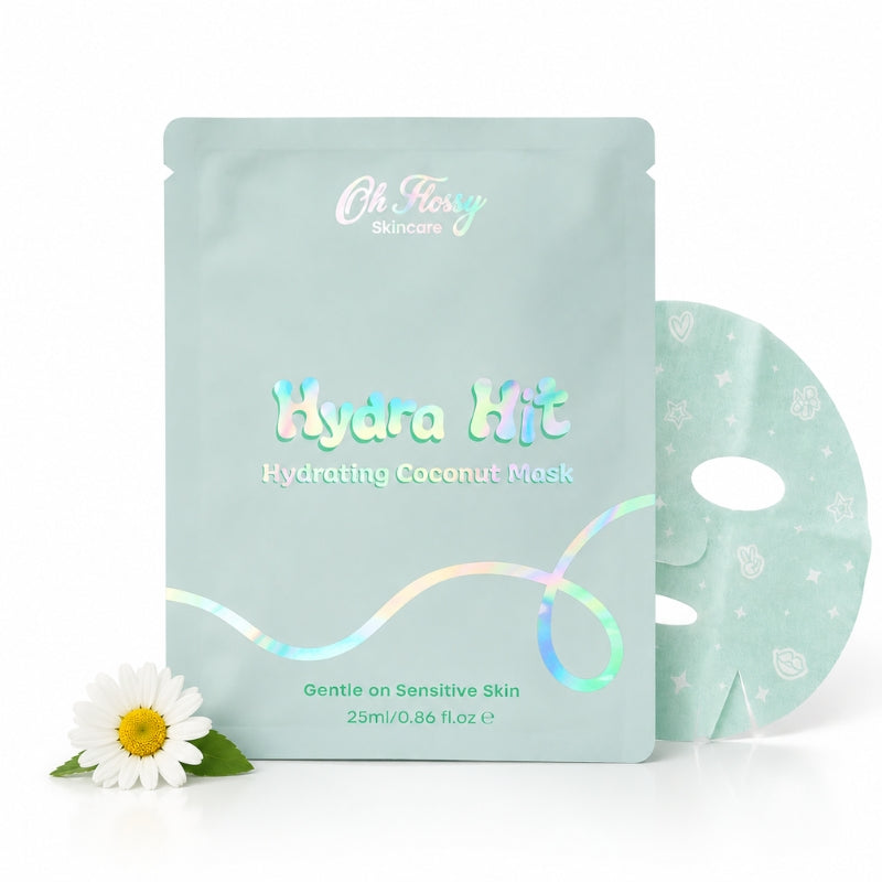 Oh Fierce Skincare Hydra Hit Hydrating Coconut Mask packaging in a light mint green pouch, shown with a matching sheet mask and a small white daisy on a clean white background.