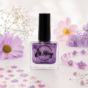 Oh Flossy Purple Glitter Kids Nail Polish bottle with pastel flowers and nail stickers