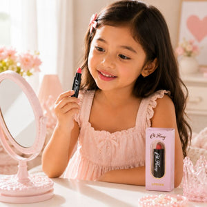 Child using Oh Flossy Natural Lipstick for Kids during pretend beauty play