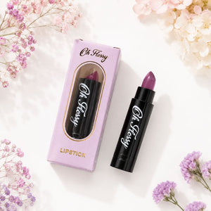 Oh Flossy Purple Natural Lipstick tube and pink packaging styled on a clean white background