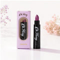 Oh Flossy Purple Natural Lipstick for Kids with pink packaging and black lipstick tube on white background