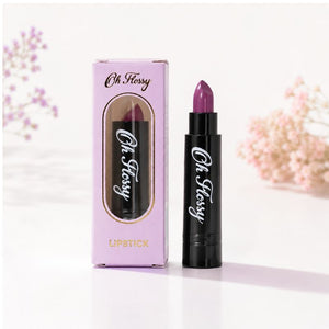 Oh Flossy Purple Natural Lipstick for Kids with pink packaging and black lipstick tube on white background
