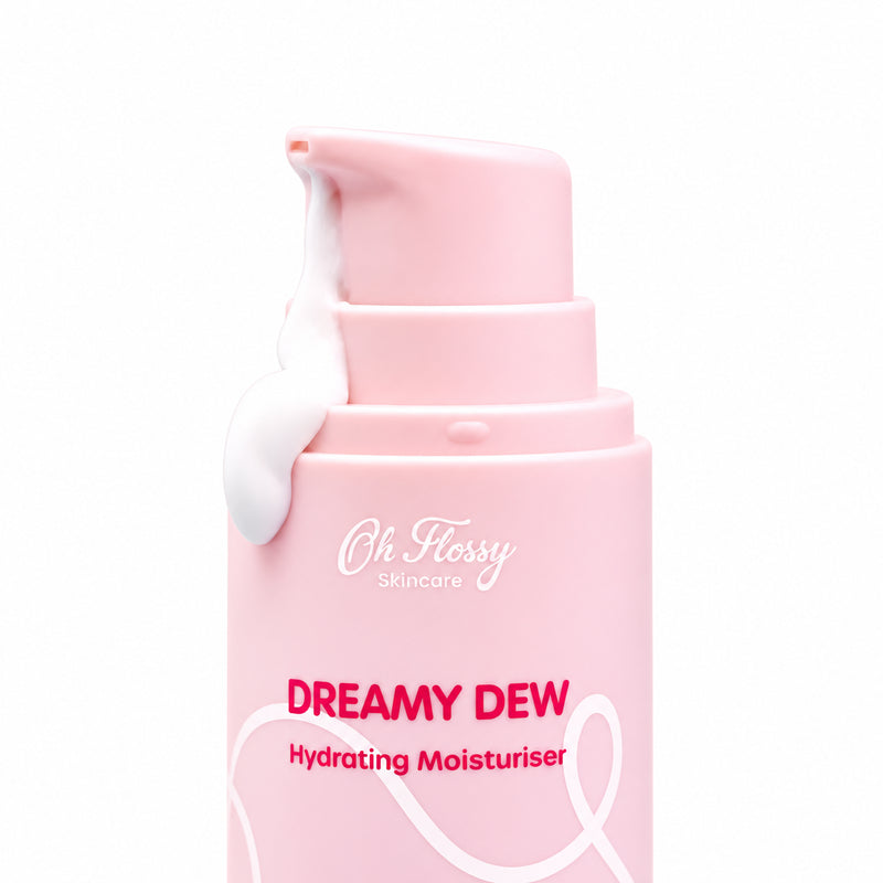 Close-up of Oh Flossy Dreamy Dew Moisturiser pink pump dispenser with white cream against a clean background.
