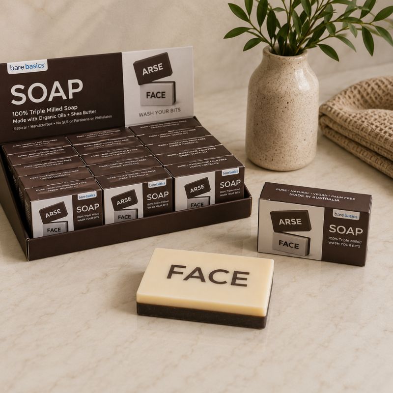 Display of bare basics soap bars with 'ARSE' and 'FACE' text on a neutral background.