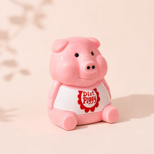 Pink piggy bank with a white shirt displaying 'Diet Piggy' on a beige background