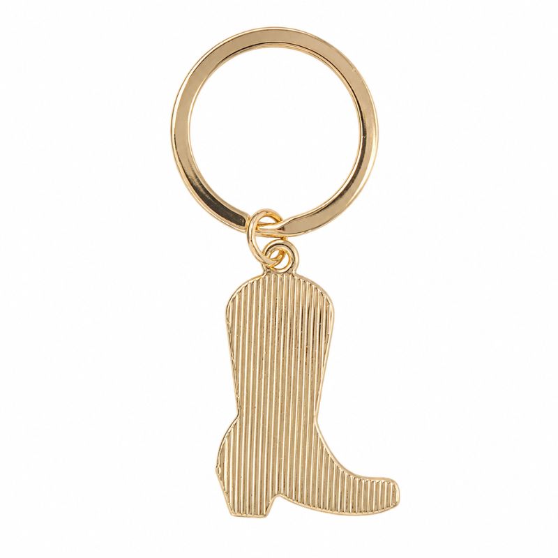 A gold-colored pink cowboy boot enamel keyring, shown against a plain white background.