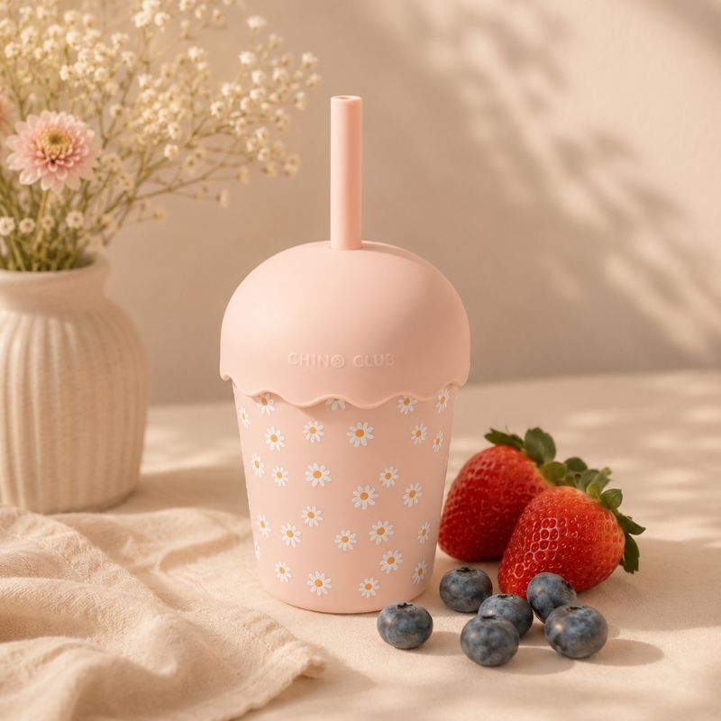 Pink Daisy Mini Smoothie Cup & Straw 200ml on a light surface with strawberries and blueberries.