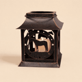 Rustic metal horse lantern candle holder with standing horse silhouette on a light beige background.