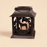 Rustic metal horse lantern candle holder with standing horse silhouette on a light beige background.