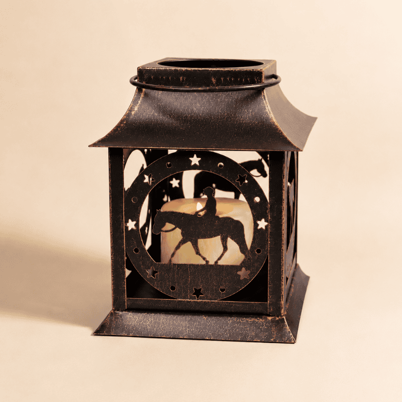 Rustic metal horse lantern candle holder with horse silhouette and star cutout details on a clean beige background.
