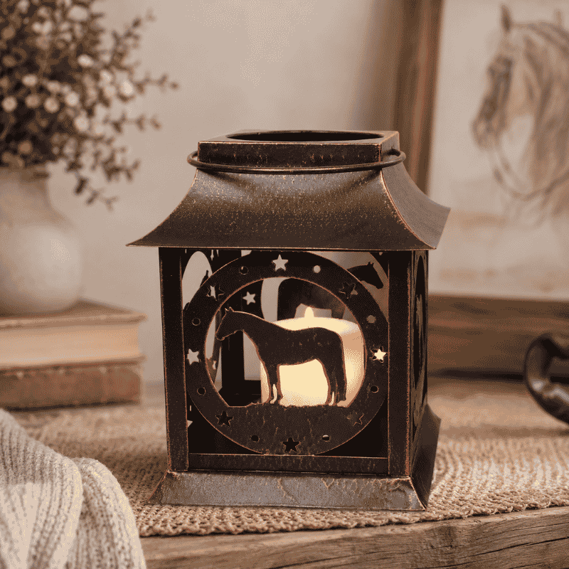 Decorative horse silhouette lantern in a warm farmhouse setting with ceramic vase and rustic home accessories.