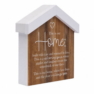 A Saddle & Bloom Home Blockword featuring a warm brown wood-grain front with white printed sentimental text and a small heart at the top.