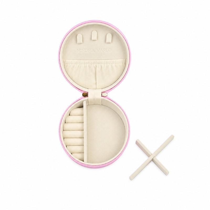 ASmall Jewellery Case – Berry with a pink border and cream-colored interior, shown on a white background with two small wooden sticks beside it.