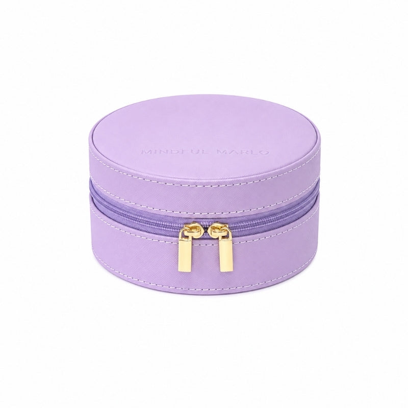 A Small Travel Jewellery Case_Violet with gold-tone zipper pulls and white stitching, shown on a plain white background.