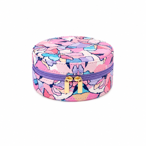 A jewelry case - willow with a vibrant pink, purple, and blue floral pattern, featuring gold-tone zipper pulls, set against a plain white background.