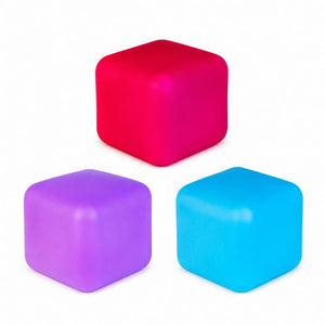 Three matte Smoosho's Colour Change Cube – Sensory Squishy Toy in bright pink, purple, and blue, arranged on a plain white background.