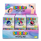A retail display box filled with multiple Smooshos Morphing Ball mystery toy packages. The display box and individual boxes feature pastel pink, purple, and blue gradient packaging with the 'Smooshos' logo and a circular window showing the colorful morphing ball inside.