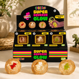 Smooshos Super Squeeze Glow Diamond Sphere Dino retail display in a modern tabletop setting